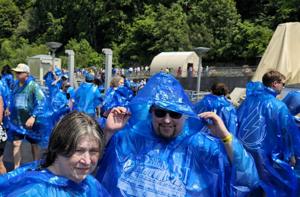 People in blue rain jackets aboard the Maid of the Mist